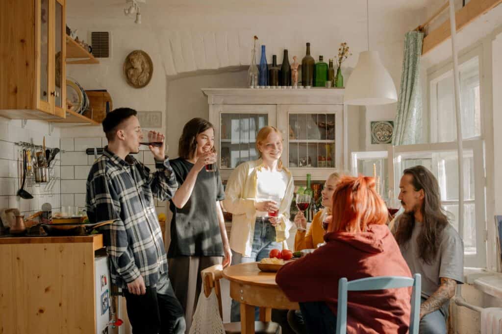 People in a shared apartment are having a meal in the kitchen