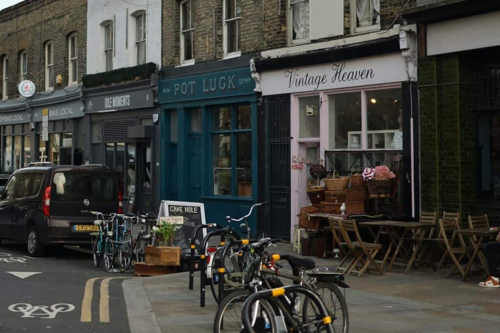 A row of shops with bicycles parked outside