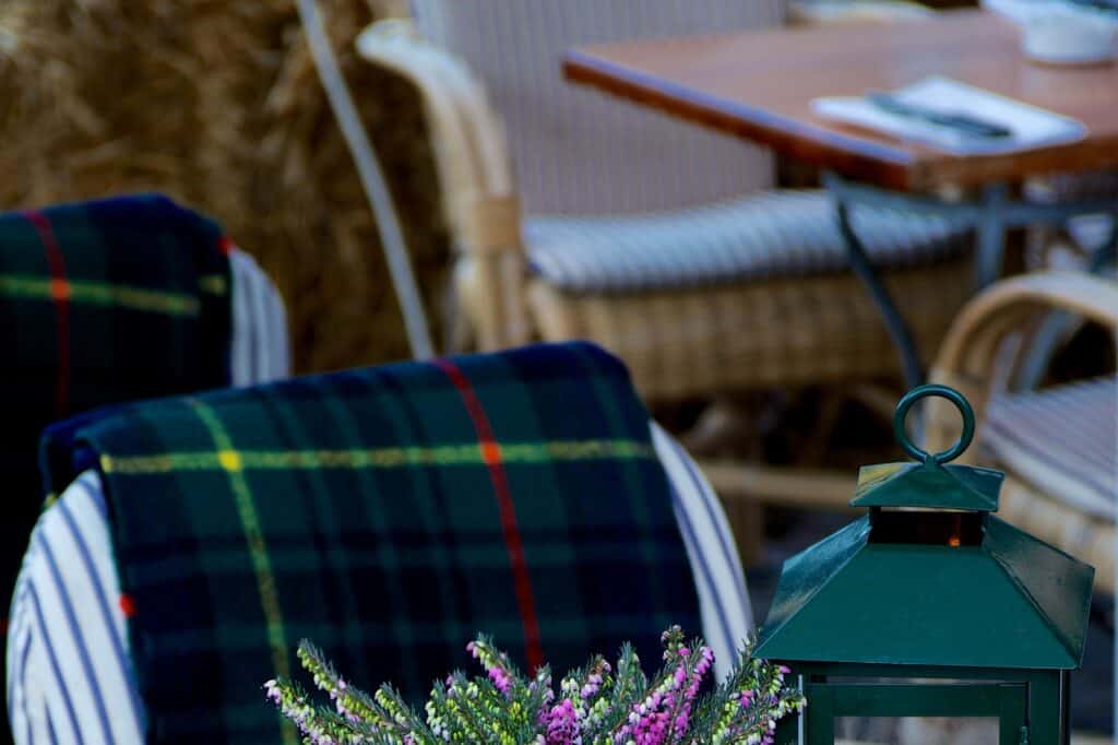 Cropped image of chairs and tables in a street cafe