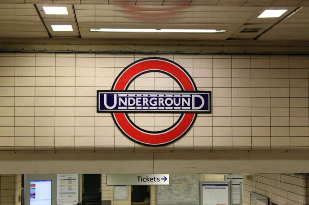 An Underground station with a ticket booth sign